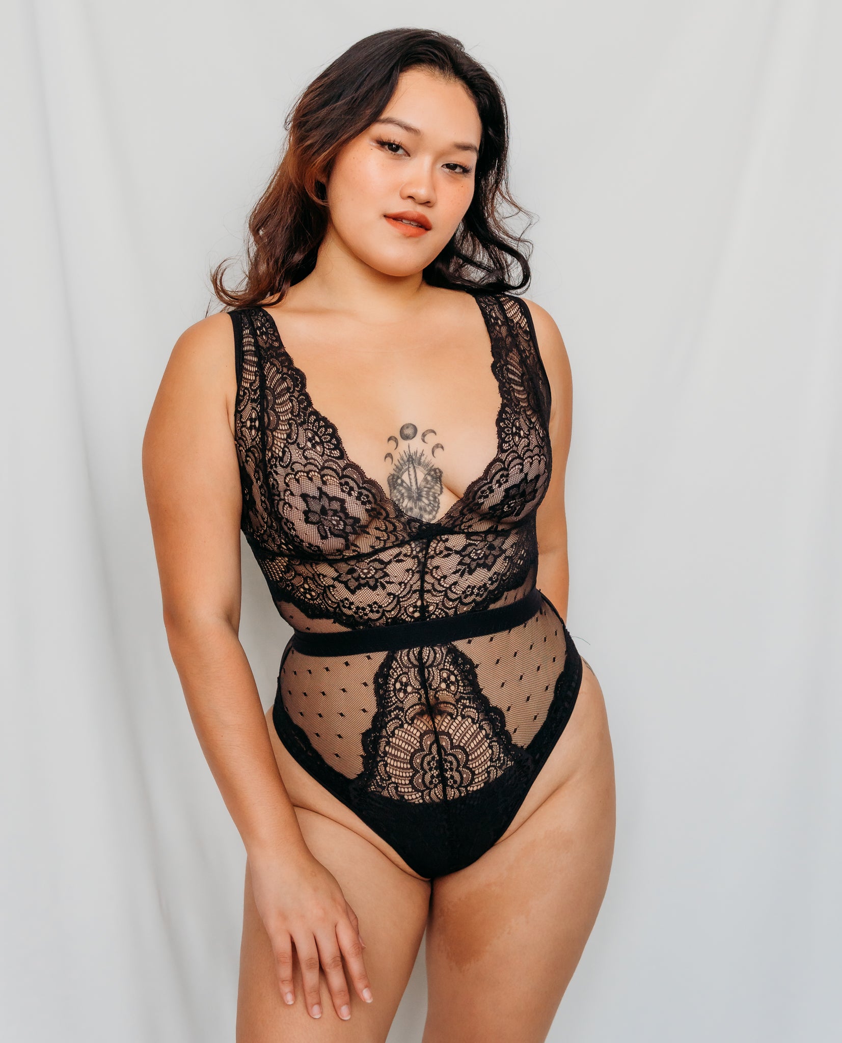 Woman wearing a black lace lingerie bodysuit