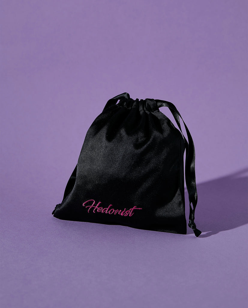 black satin storage pouch with hedonist brand name