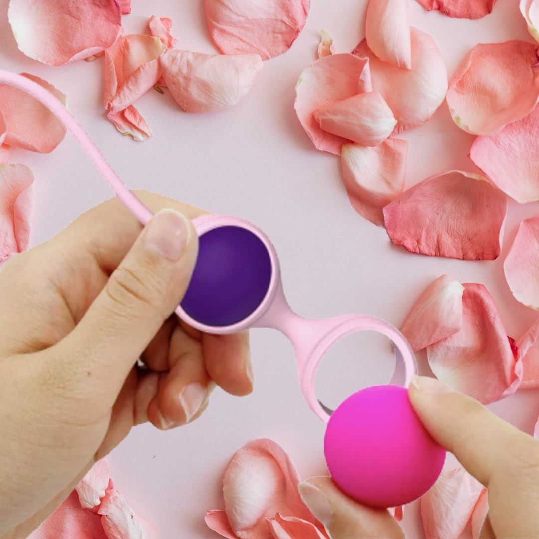 Hand holding Gaia Kegel Balls Wellness Set