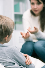 mother patiently explaining to son