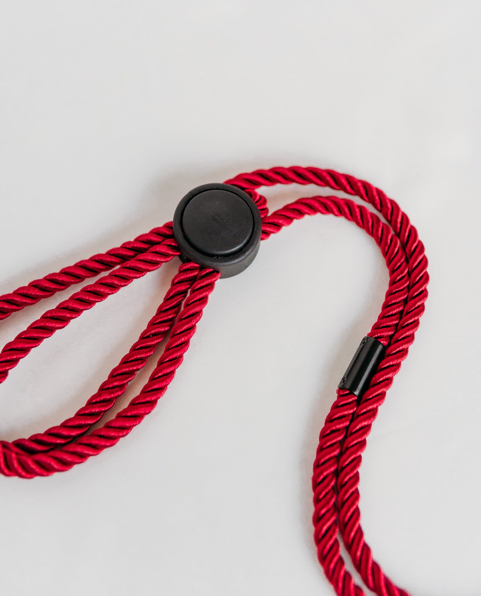 Red rope lanyard with black metal clip