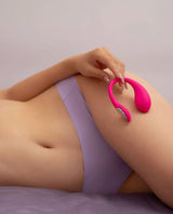 Person using a Lush Mini on their leg with a plain background