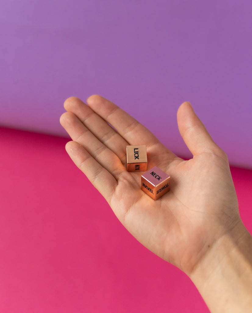 Lifestyle image with naughty dice in hand
