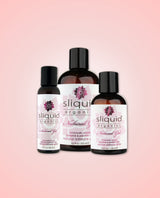 Three bottles of Sliquid Organics natural gel in different sizes on a pink background