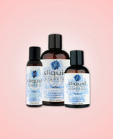 Three bottles of Sliquid Organics natural intimate glide on a pink background