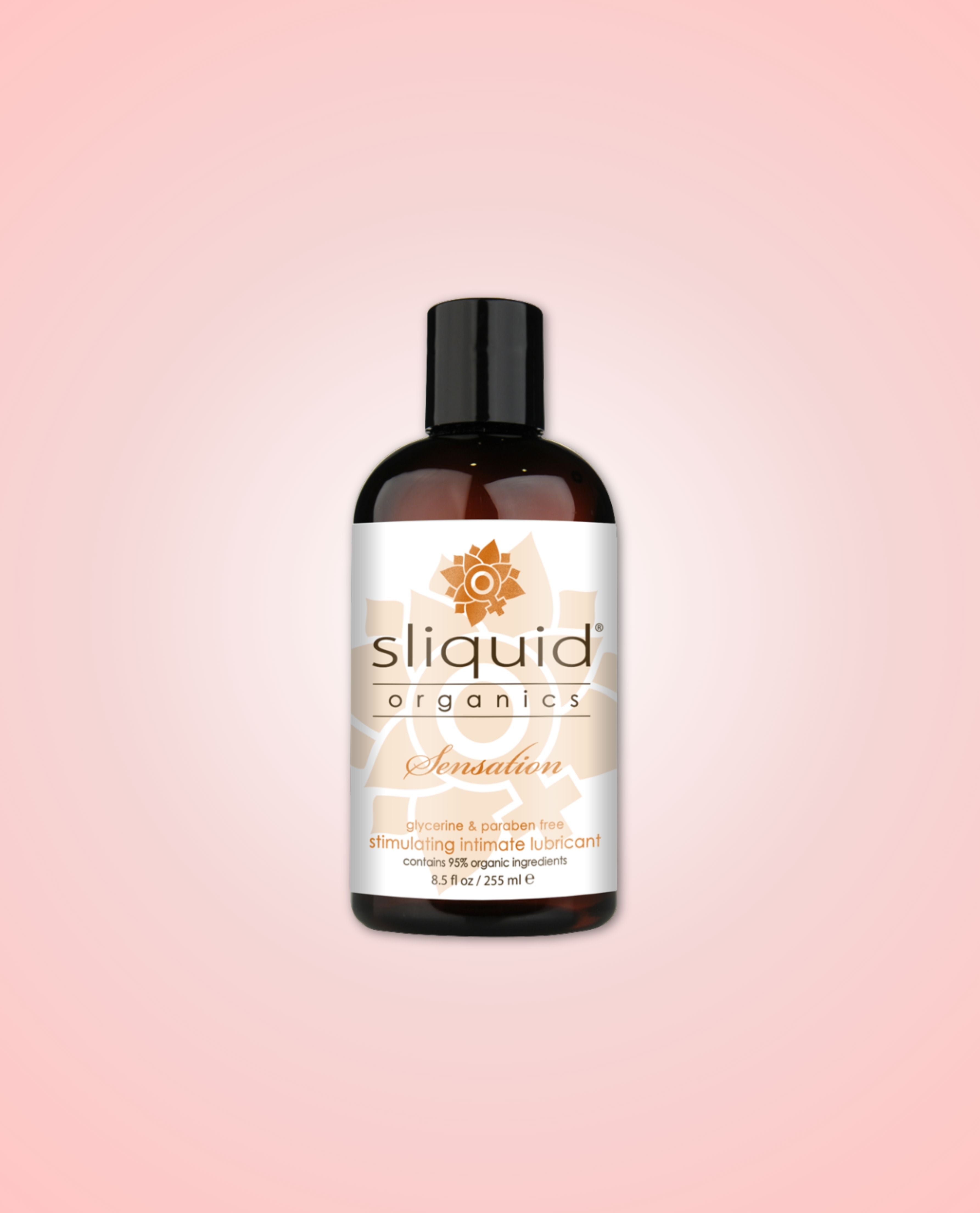 Sliquid Organics Sensation 255ml lubricant on a pink background