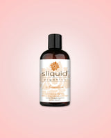 Sliquid Organics Sensation 255ml lubricant on a pink background