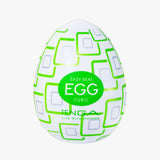 Tenga Egg Cubic packaging with green and white design on a white background