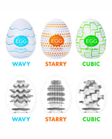 Three different designs of Tenga 'EGG' products with labels 'Wavy', 'Starry', and 'Cubic' on a white background.