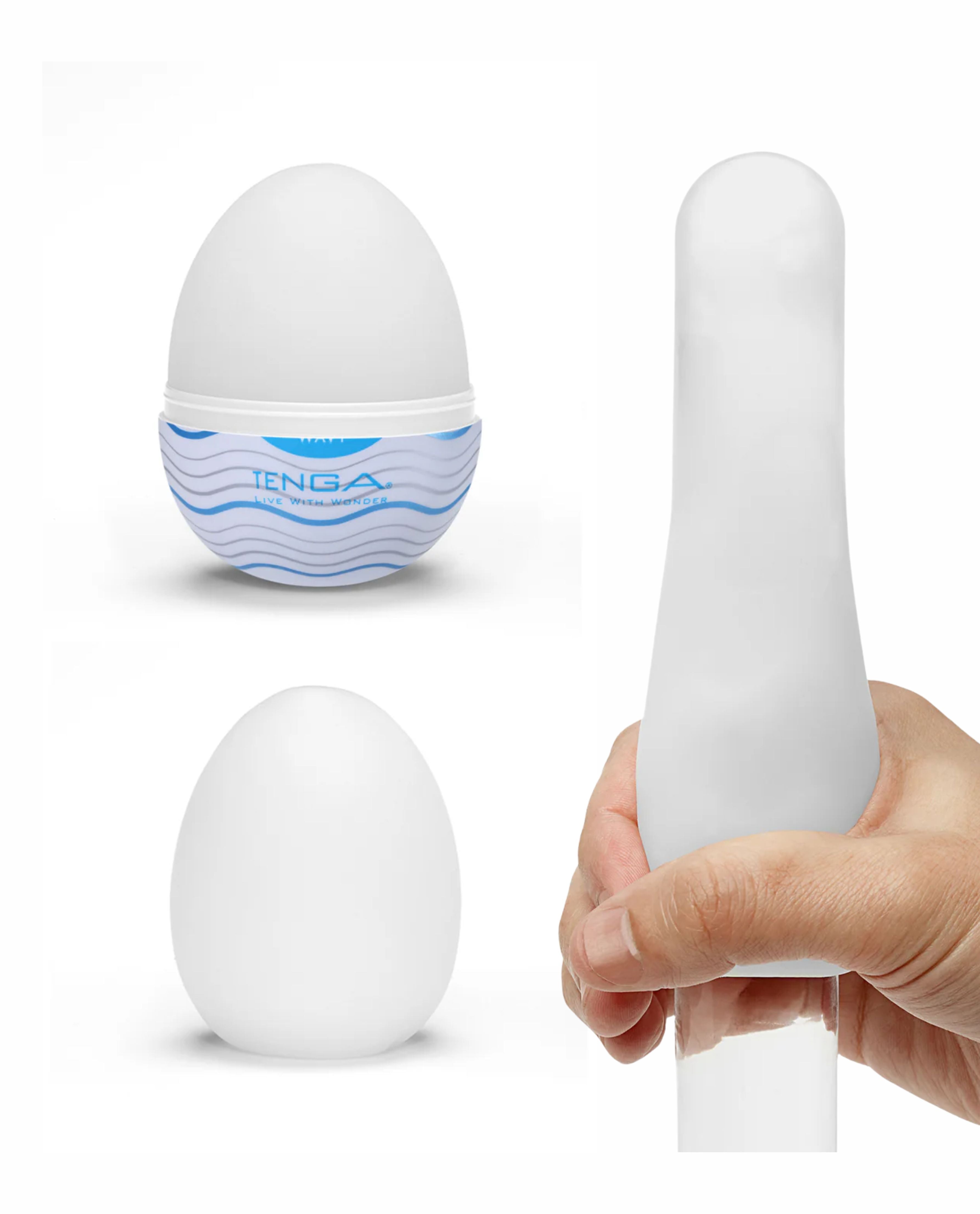 Tenga Egg masturbator stretched by hand, showing on a cylindrical device on a white background