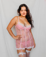 Woman wearing a pink babydoll lingerie with lace trim