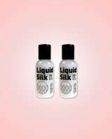 Two bottles of Liquid Silk 50ml on a gradient pink background