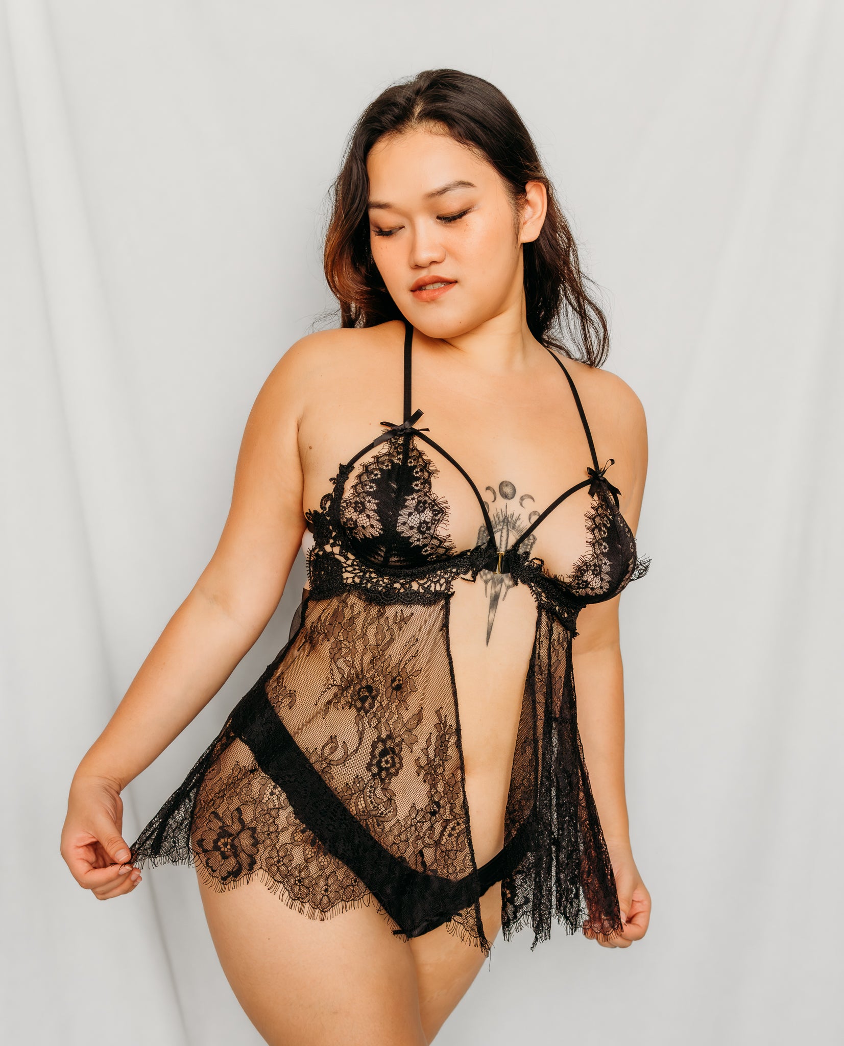 Woman wearing a black lace lingerie set 