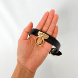 Black leather collar with gold ring