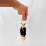 black leather connectors with gold accents