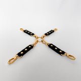 Black leather hogtie with gold hardware 