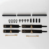 black spreader bar with leather cuffs and connectors flatlay