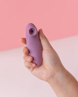 hand holding mystiva mini purple sucker