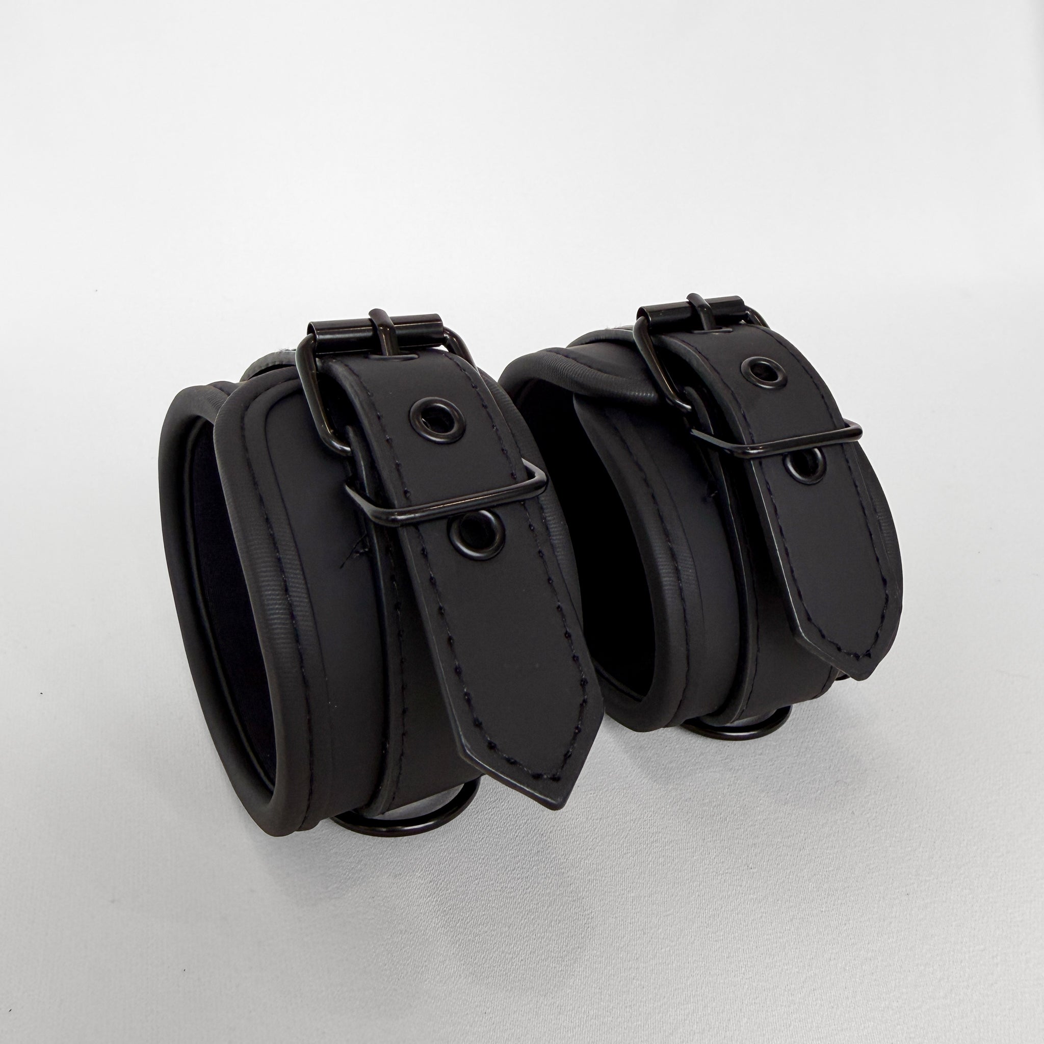 Two black leather cuffs
