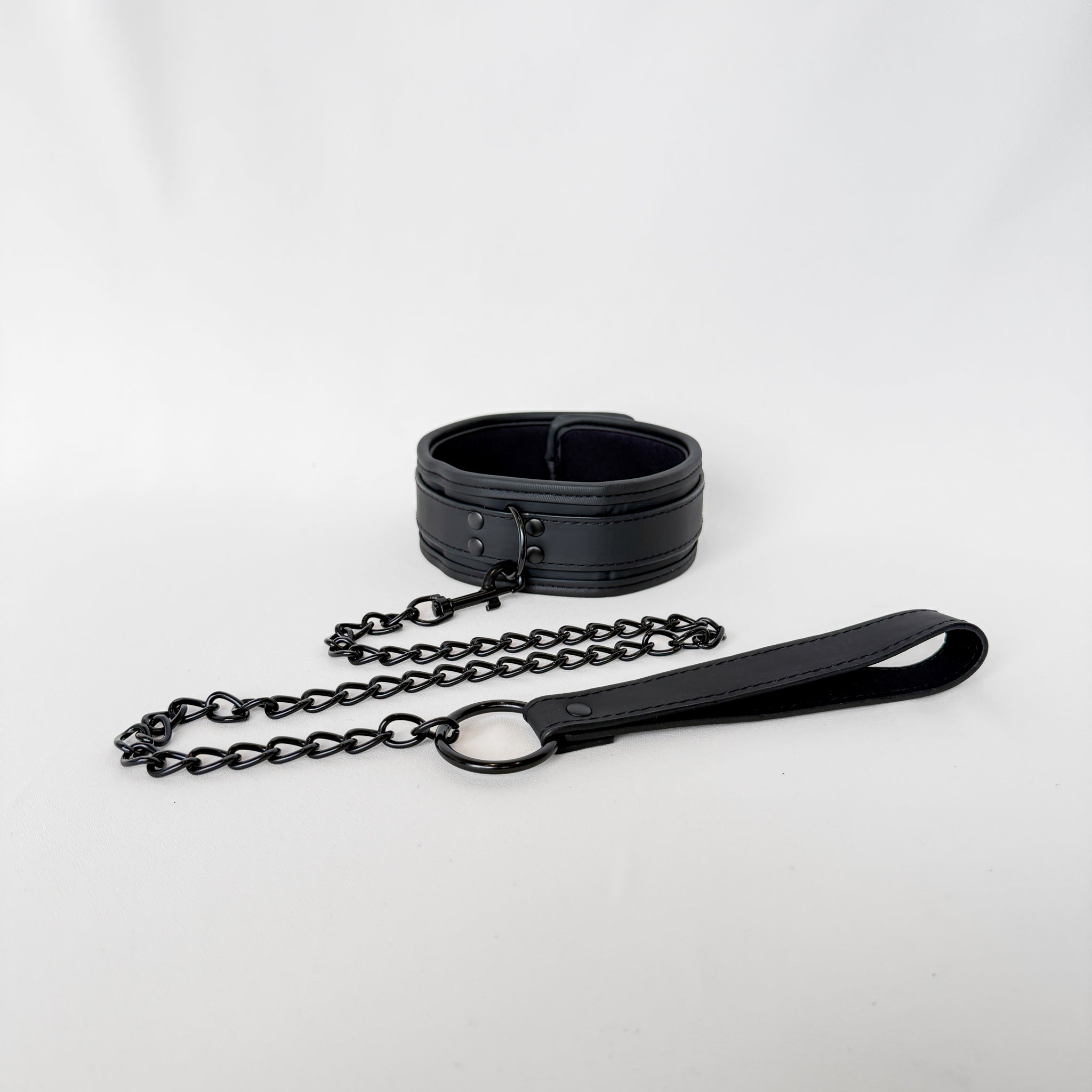 Black leather collar with chain and handle