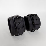 Pair of black leather cuffs 