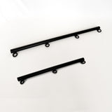 two black spreader bar rods with ring connectors