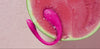 Lush Mini in a watermelon, showing its waterproof IPX7 qualities. 