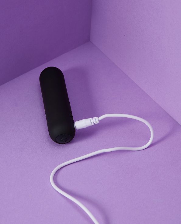Black silicone Raven bullet vibrator travel-friendly with charging cable