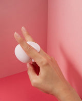 Two fingers holding Bunsy Vibrator