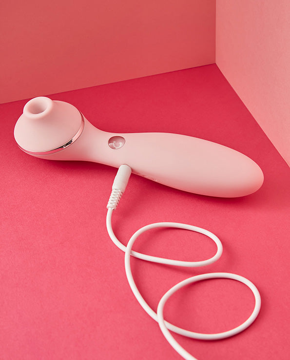 pink silicone Kiss Toy Polly plus Clit sucker and vibrator with charging cable