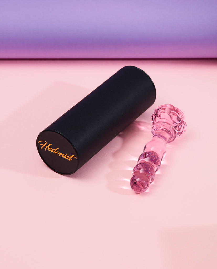 Pink Rosie glass bubble dildo with long round black Hedonist packaging box