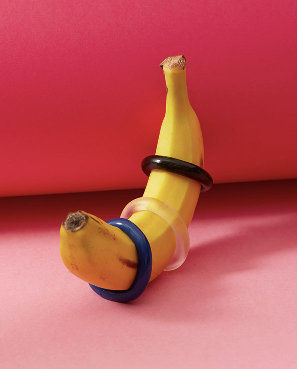 blue transparent and black jelly stretchable cock rings on a banana